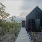Blackened Timber Cottages by Format Elf Architekten
